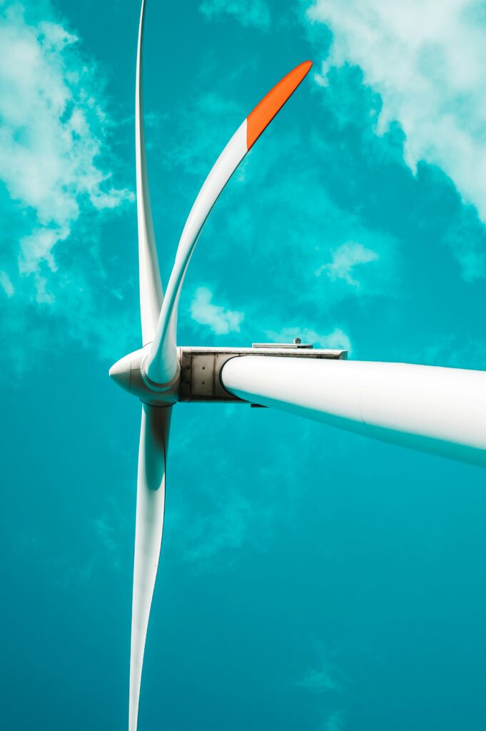 Windmill image from below over a dark blue background